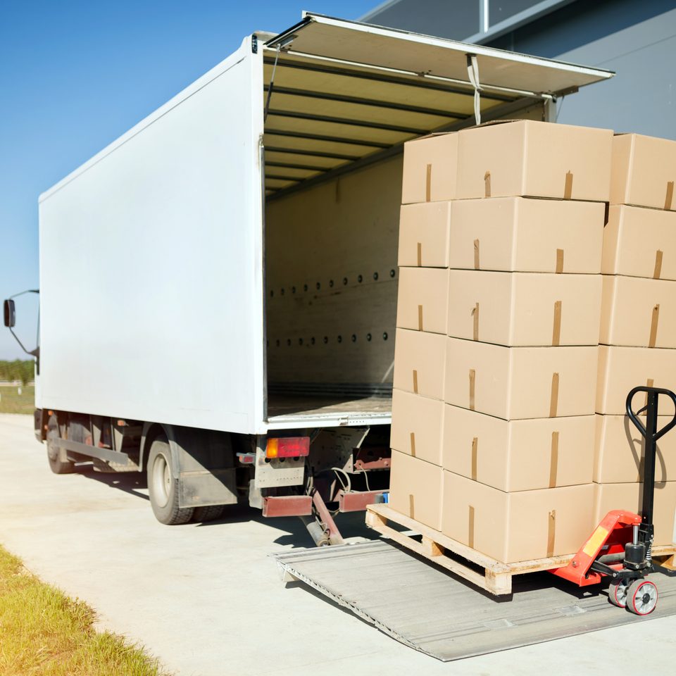 Truck transporting goods packed in boxes from warehouse